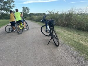 Nancy and C J on gravel road at Augusta, Kansas lake